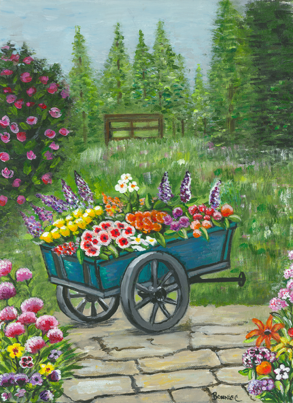 Stretched Canvas print of Wheel barrow in the flower garden