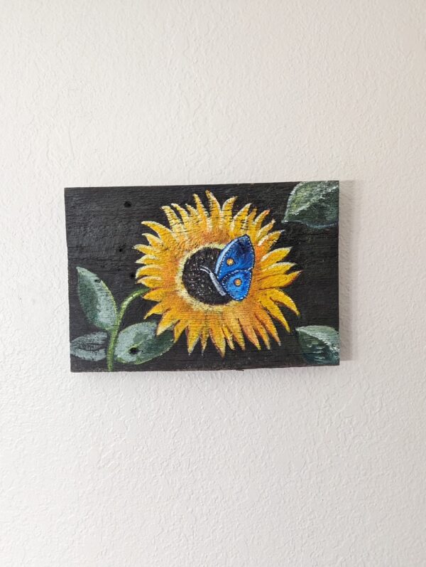 Barn wood painting of a sunflower